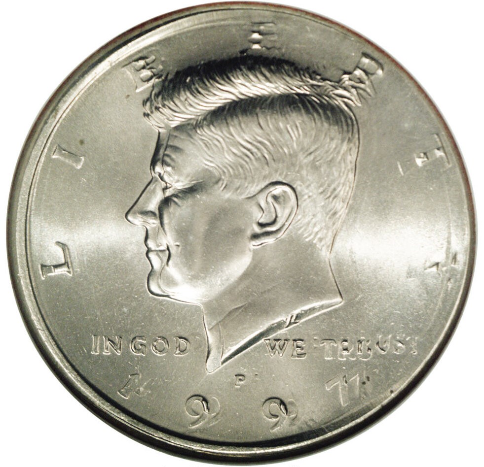 1997-D Kennedy Half Dollar broadstruck and double-struck combination error showing widened coin and overlapping design elements